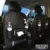 PU Leather Car Organizer hanging on the back seat of a vehicle, showcasing storage compartments and a stylish design.