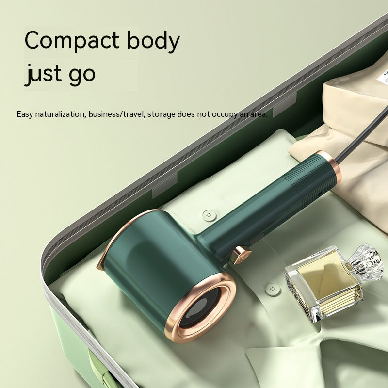 Mini Portable Garment Steamer shown in a suitcase, highlighting its compact design for travel and easy storage.